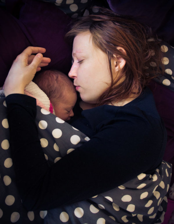 Photo by David Veksler - kissing mother to her child